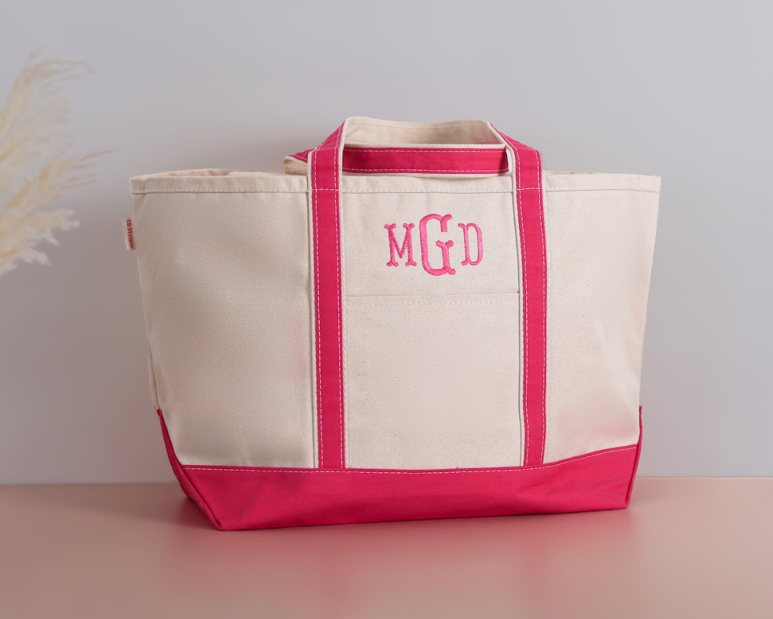 Monogrammed canvas tote bag with zip top and front pocket